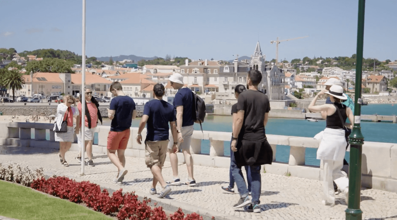Group walking together on their company retreat in Portugal